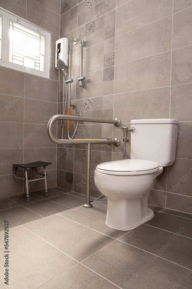 Interior of bathroom for the elderly people. Handrail for elderly ...
