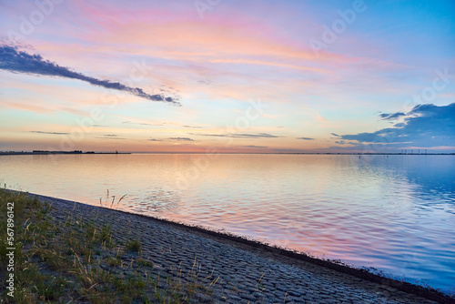 Colourful sunset on the coast of the North Sea Yereseke Netherlands