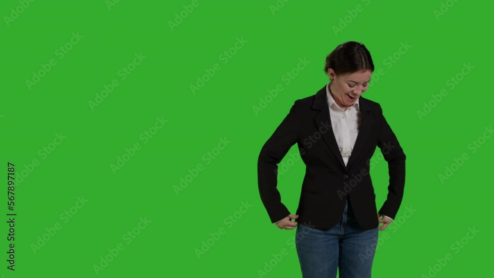 Front view of manager standing on greenscreen backdrop, feeling confident in corporate office suit. Smiling worker posing on camera and feeling optimistic in studio, positive formal person. Front view of manager standing on greenscreen backdrop, feeling confident in corporate office suit. Smiling worker posing on camera and feeling optimistic in studio, positive formal person.