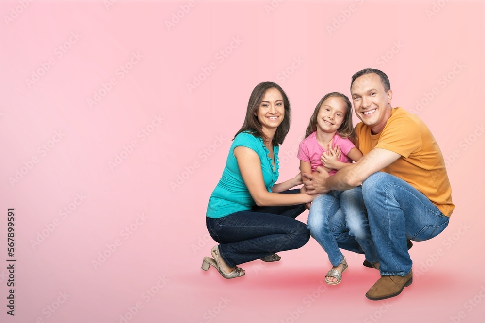 Happy young parents with cute child