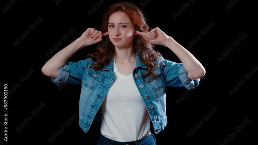 (Camera: ARRI ALEXA, 35mm lens, real time) A young caucasian woman plugs her ears. For more variations of this clip, check out this seller's other videos. (Camera: ARRI ALEXA, 35mm lens, real time) A young caucasian woman plugs her ears. For more variations of this clip, check out this seller's other videos.