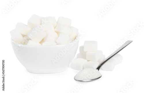 Ceramic bowl and spoon with refined sugar cubes on white background