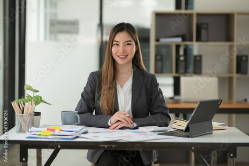 Asian business woman Working at the office, happy working day smile