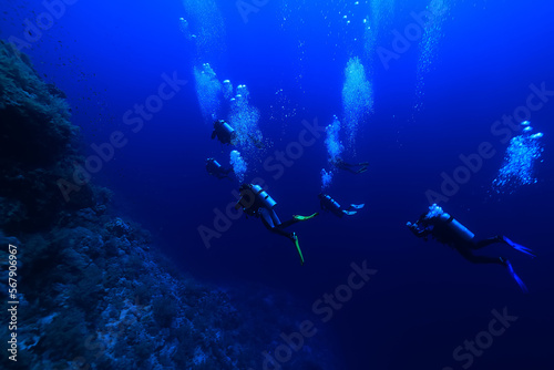 group of divers depth bubbles dive