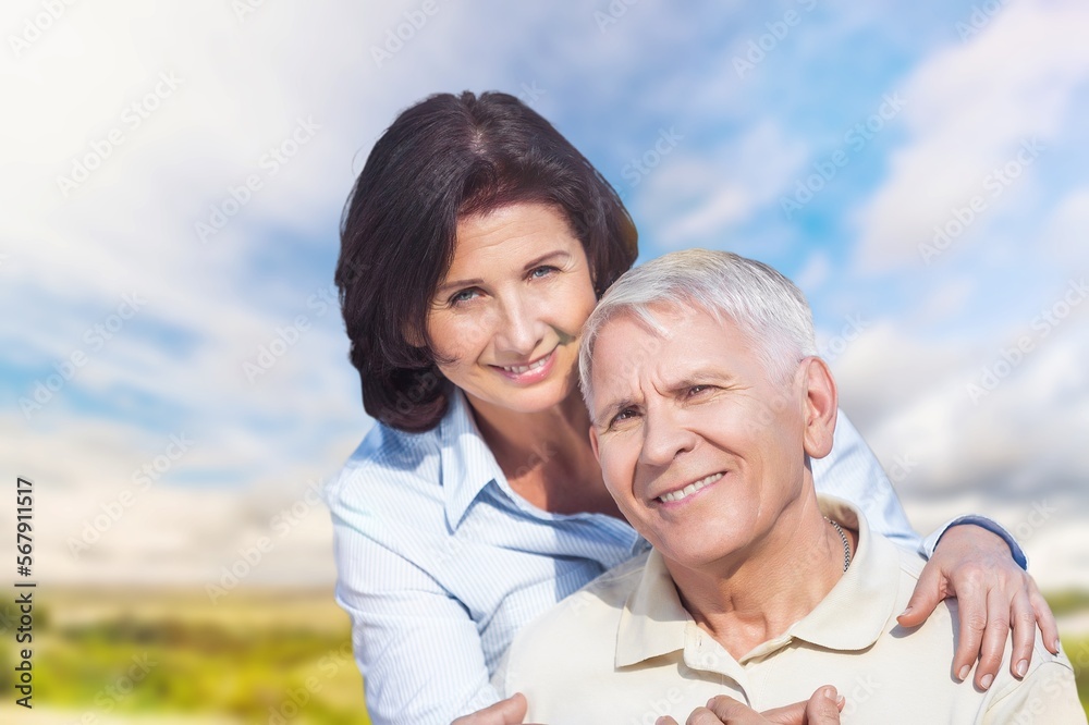 Mature old couple looking happy outdoors at farm,
