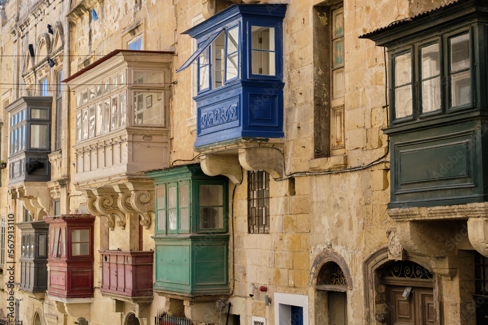 Traditional colourful enclosed wooden balconies, called gallariji, on St. Paul Street - Valletta, Malta