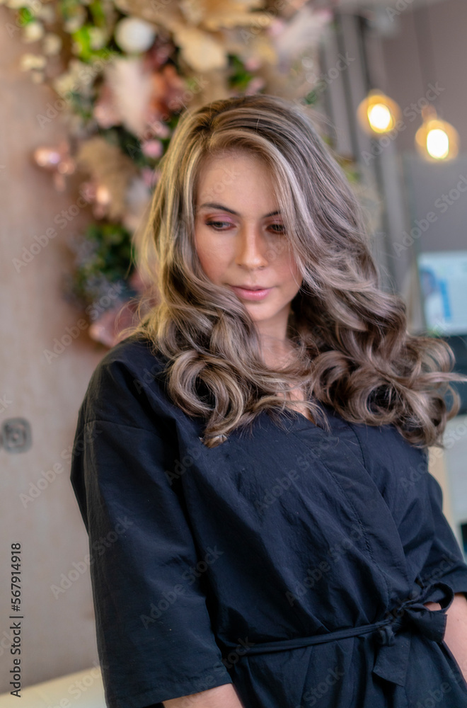 model in the beauty salon, beautiful woman painting her hair in the hairdresser or beauty salon and making up pretty for a party or a wedding model in the beauty salon, beautiful woman painting her hair in the hairdresser or beauty salon and making up pretty for a party or a wedding
