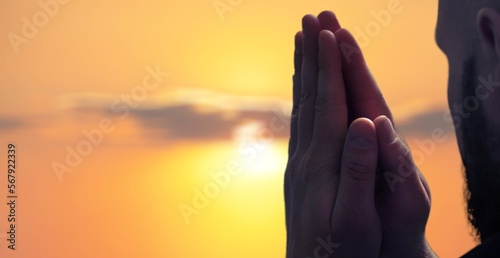 Silhouette of praying human worship to god.