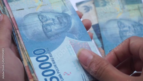 Stock Footage indonesian rupiah the official currency of Indonesia. Bank Indonesia notes background photo