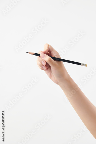 흰 배경에 연필을 들고 있는 여성의 손. 합성 이미지 손 소스