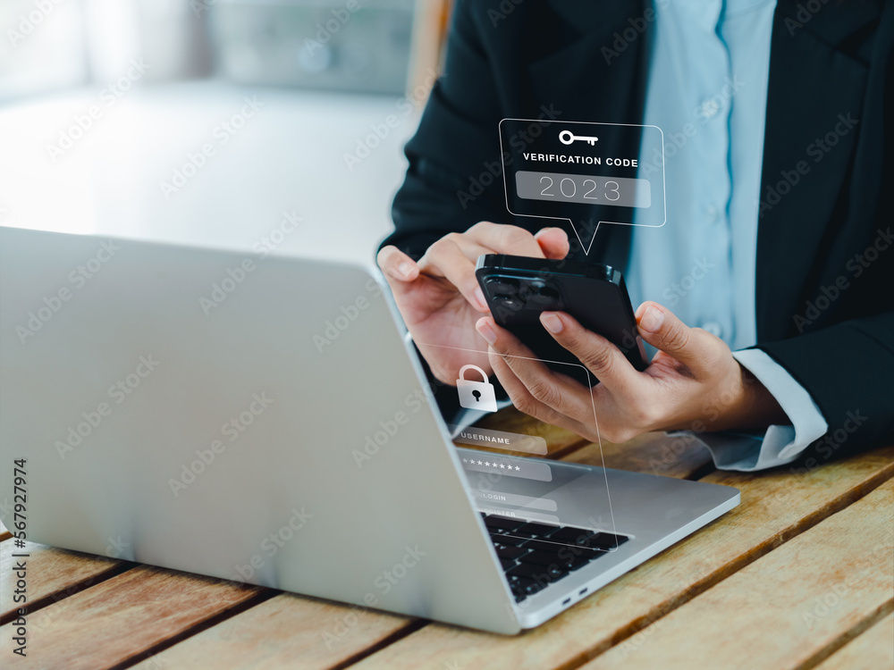 Fototapeta premium Two steps authentication (2FA) concept. 2023, Verification code and key icon alert on smart phone while using computer for validate password page, Identity verification, cyber security technology.