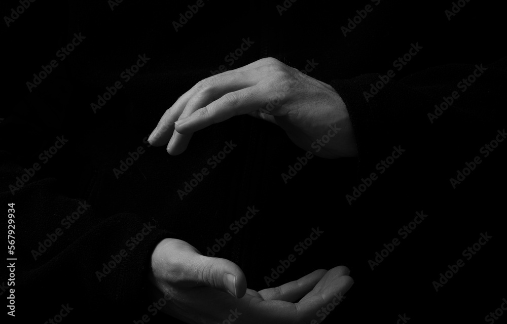 Fototapeta premium hands in the dark