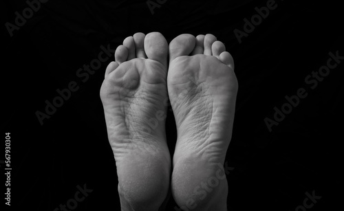 feet of the legs man. Man legs. Shadow. Black and white photo. 
