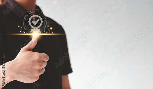 Obraz na plátně Man guarantee on customer service or business quality by thumb up with virtual medal icon