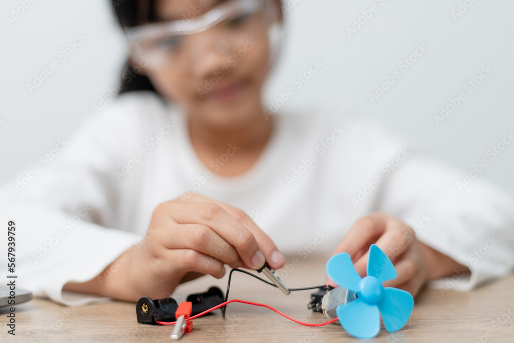Asia students learn at home in coding robot cars and electronic board cables in STEM, STEAM, mathematics engineering science technology computer code in robotics for kids concept. Asia students learn at home in coding robot cars and electronic board cables in STEM, STEAM, mathematics engineering science technology computer code in robotics for kids concept.