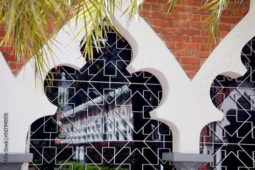 Close up Screen windows with reflection in Jamek Mosque in Kuala Lumpur, Malaysia on August 6, 2022                                                            photo