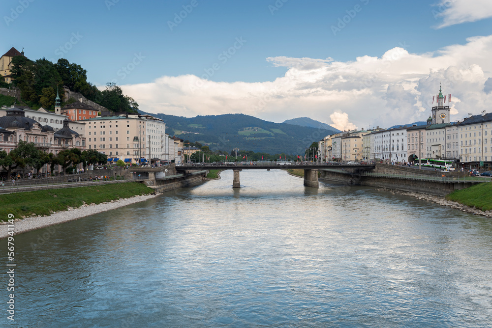 Views of the river Salzach from the Marko-Feingold-Steg bridge, Salzburg, Austria. It can be seen the city hall clock tower and the Staatsbrücke bridge