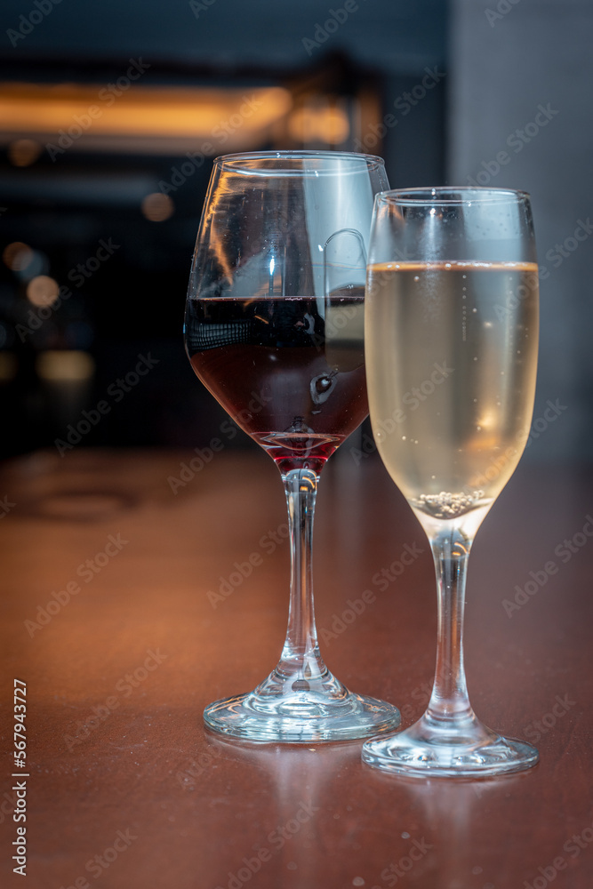 Wine and champagne glass on a bar table. Wine and champagne glass on a bar table.