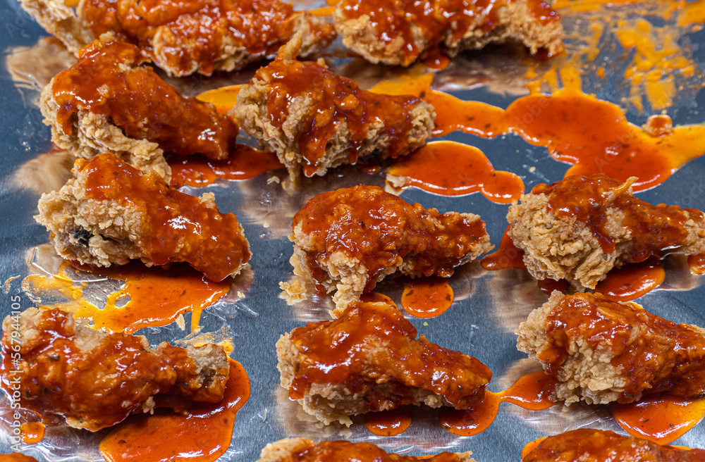 spicy sauce with fried chicken on friod plate spicy sauce with fried chicken on friod plate