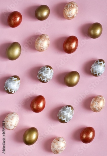 Colorful Easter Eggs a pastel pink background. Vertical Banner for easter holiday. Flat lay composition