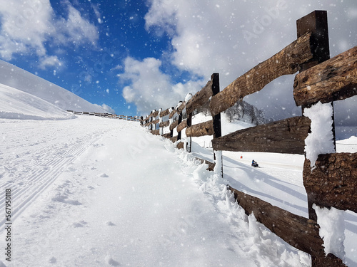 snow path and fence to the top of the mountain in anilio ski center metsovo greece photo