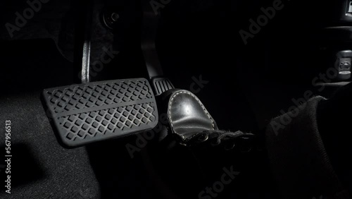 Accelerate and Brake. Foot pressing foot pedal of a car to drive ahead. Accelerator and brake pedal in a car. Driver driving the car by pushing accelerator pedals of the car. inside vehicle automobile