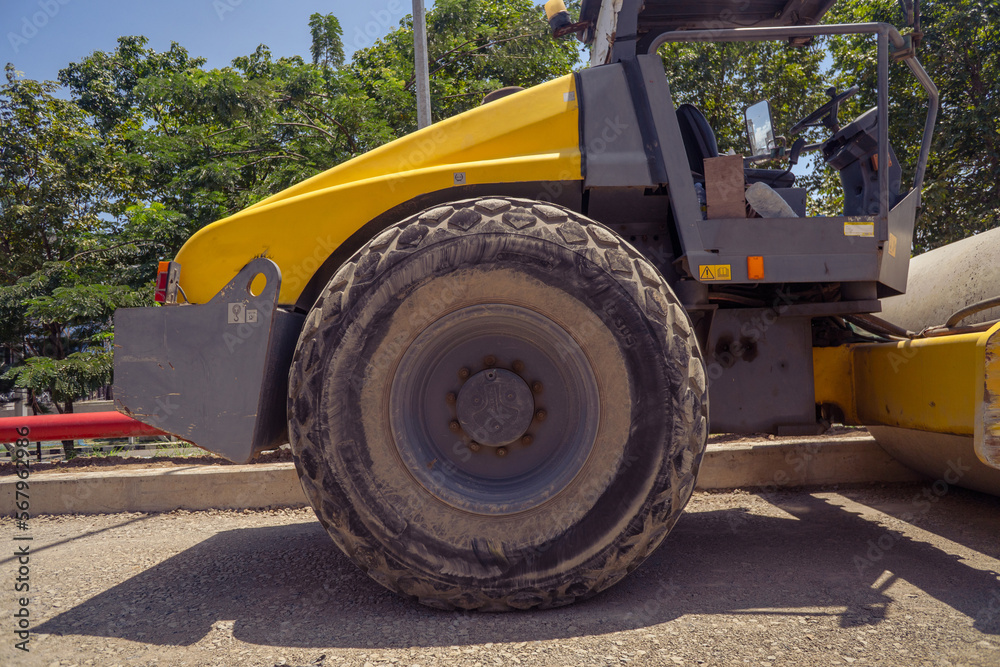 Fototapeta premium Land scraper and Vibro roller the heavy equipment for pretreatment road construction. photo is suitable to use for industry background photography, power plant poster and electricity content media.