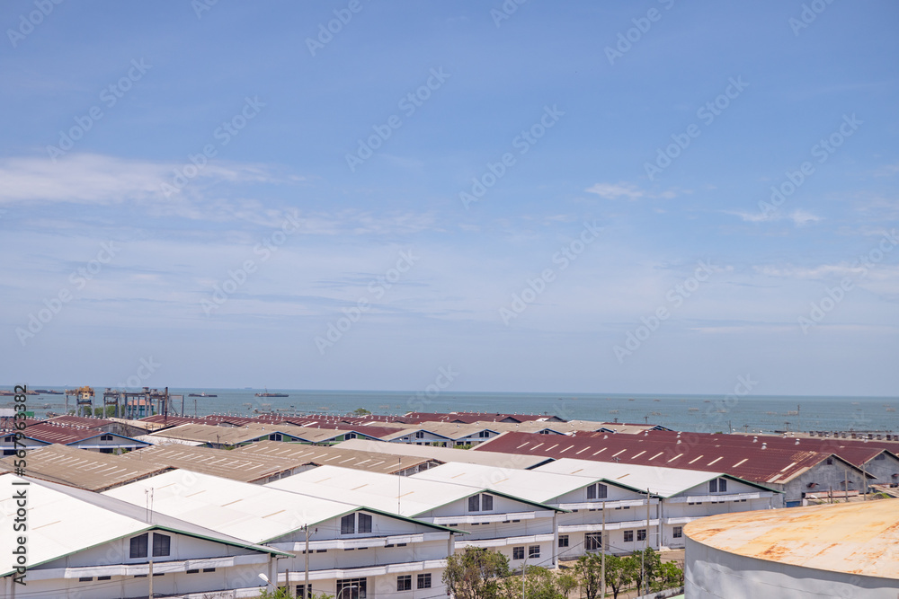 Arial view of power plant project with blue sky and cloudy vibes. The photo is suitable to use for industry background photography, power plant poster and electricity content media.