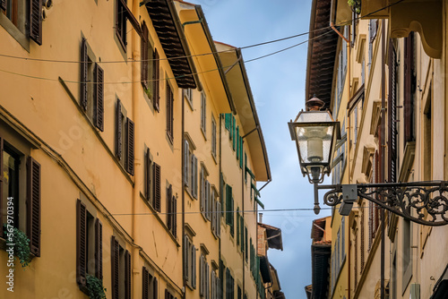 Fototapeta Naklejka Na Ścianę i Meble -  Gothic buildings on a narrow street in Centro Storico of Florence, Italy