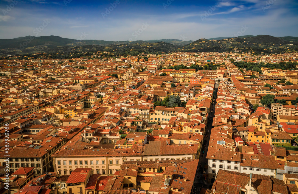Aerial view of Florence skyline, Tuscan mountains and terracotta roofs, Italy