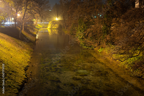 Foggy vie of the channel around the citywall in Treviso in winter season photo