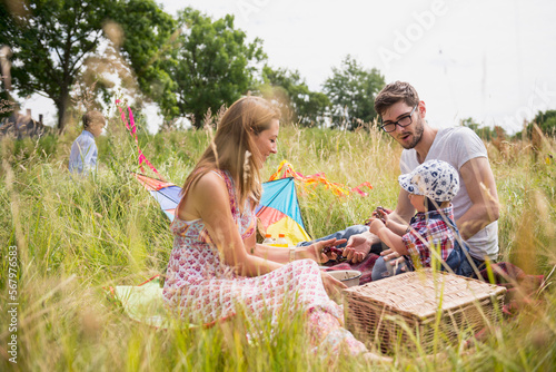 Family enjoying picnic in the countryside, Bavaria, Germany photo