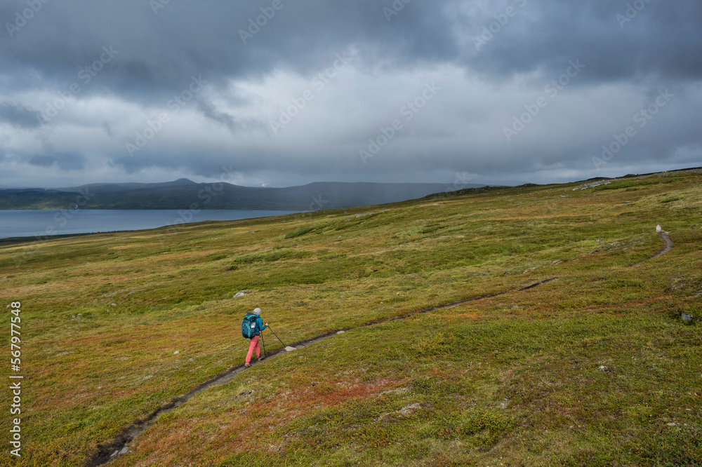 Hiker on trail, Pandelantaleden - Padjelanta Trail, Sweden Hiker on trail, Pandelantaleden - Padjelanta Trail, Sweden