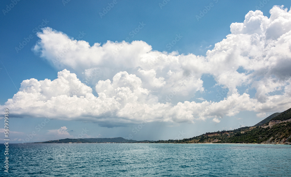 Seascape. Thick Cumulus clouds over the sea coast. Seascape. Thick Cumulus clouds over the sea coast.