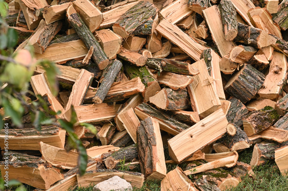 The firewood is lying on a pile. The firewood is lying on a pile.