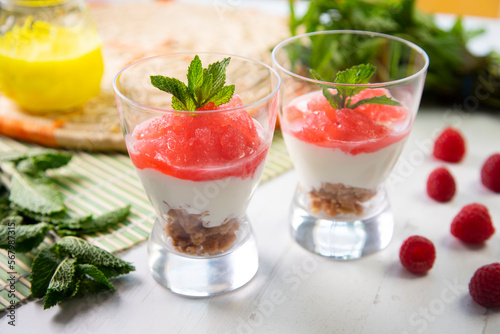 Dessert cups with yogurt and strawberry granita.