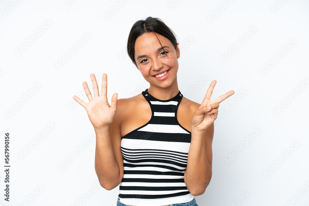 Young hispanic woman isolated on white background counting seven with fingers Young hispanic woman isolated on white background counting seven with fingers