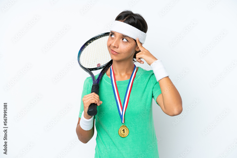 Young tennis player woman isolated on white background having doubts and thinking Young tennis player woman isolated on white background having doubts and thinking