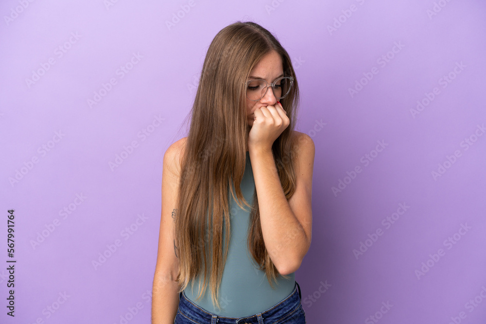 Young Lithuanian woman isolated on purple background having doubts Young Lithuanian woman isolated on purple background having doubts