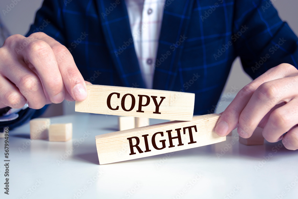Obraz premium Close up on businessman holding a wooden block with 