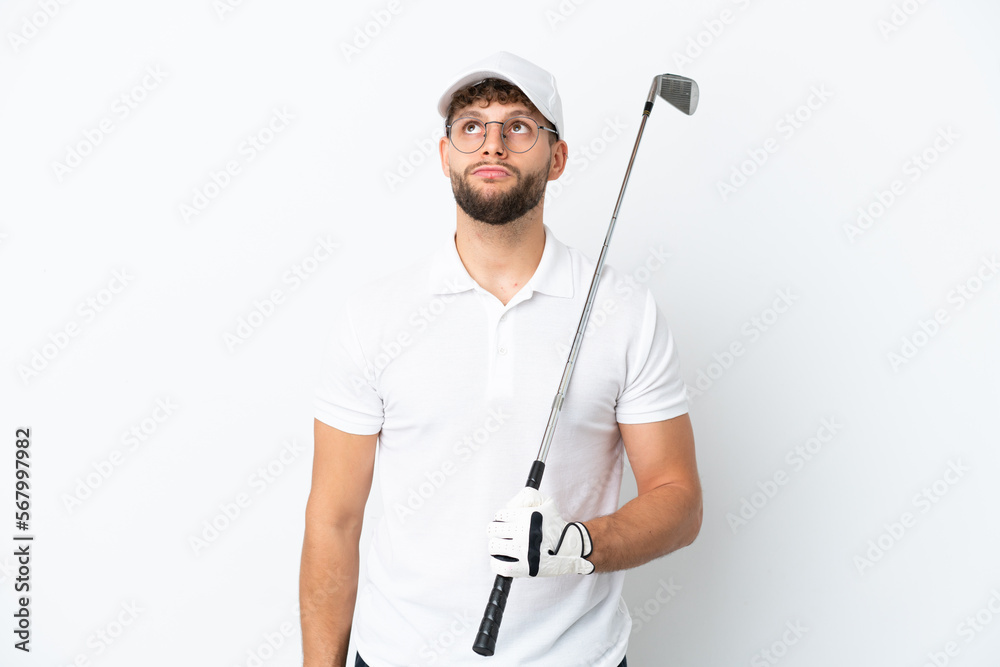 Handsome young man playing golf isolated on white background and looking up Handsome young man playing golf isolated on white background and looking up