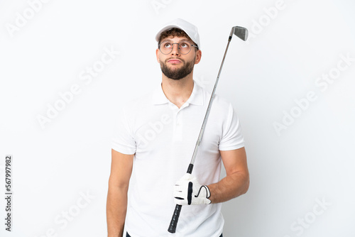 Handsome young man playing golf  isolated on white background and looking up