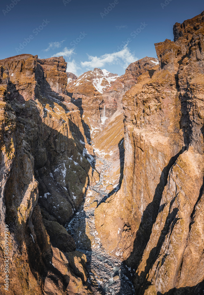 secret canyon with waterfall from aerial view