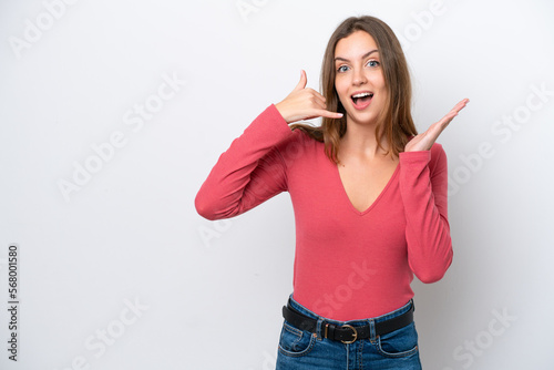 Young caucasian woman isolated on white background making phone gesture and doubting
