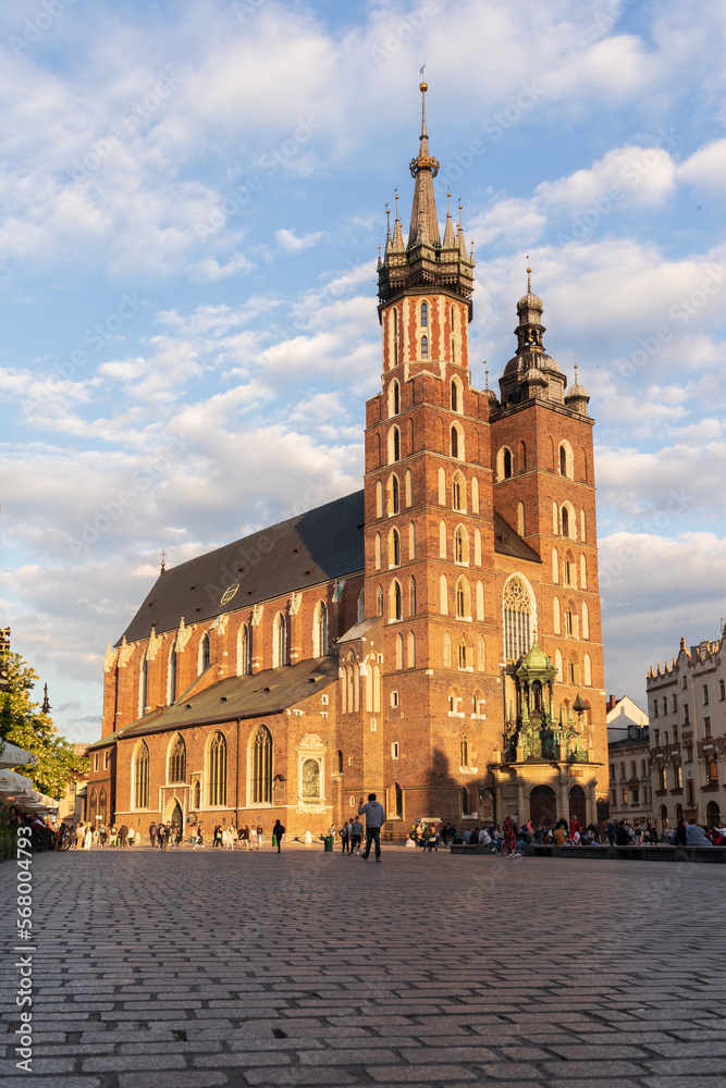 Naklejka premium Building church historical cathedral looking up view Krakow sunset sky