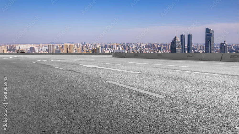 Fototapeta premium Road ground and financial district architecture