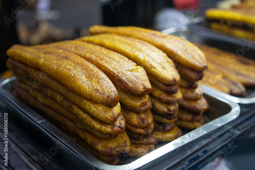 Honey bananas are famous in the old Tangerang market. served with milk chocolate and grated cheese on top. photo