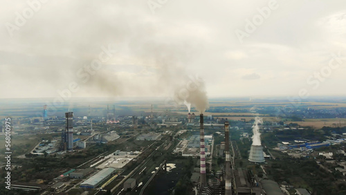 CHERKASY, UKRAINE, SEPTEMBER 12, 2018: Big Power plant , factory with pipes, expelling smoke into sky. Smoke from industrial chimney. ecology, pollution of the environment.