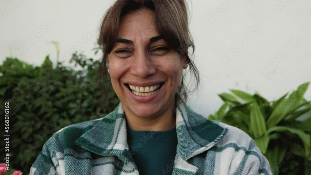 Happy Hispanic woman smiling in front of camera