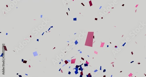 Red and blue confetti particles explosions animation on a white Background with luma matte channel. photo